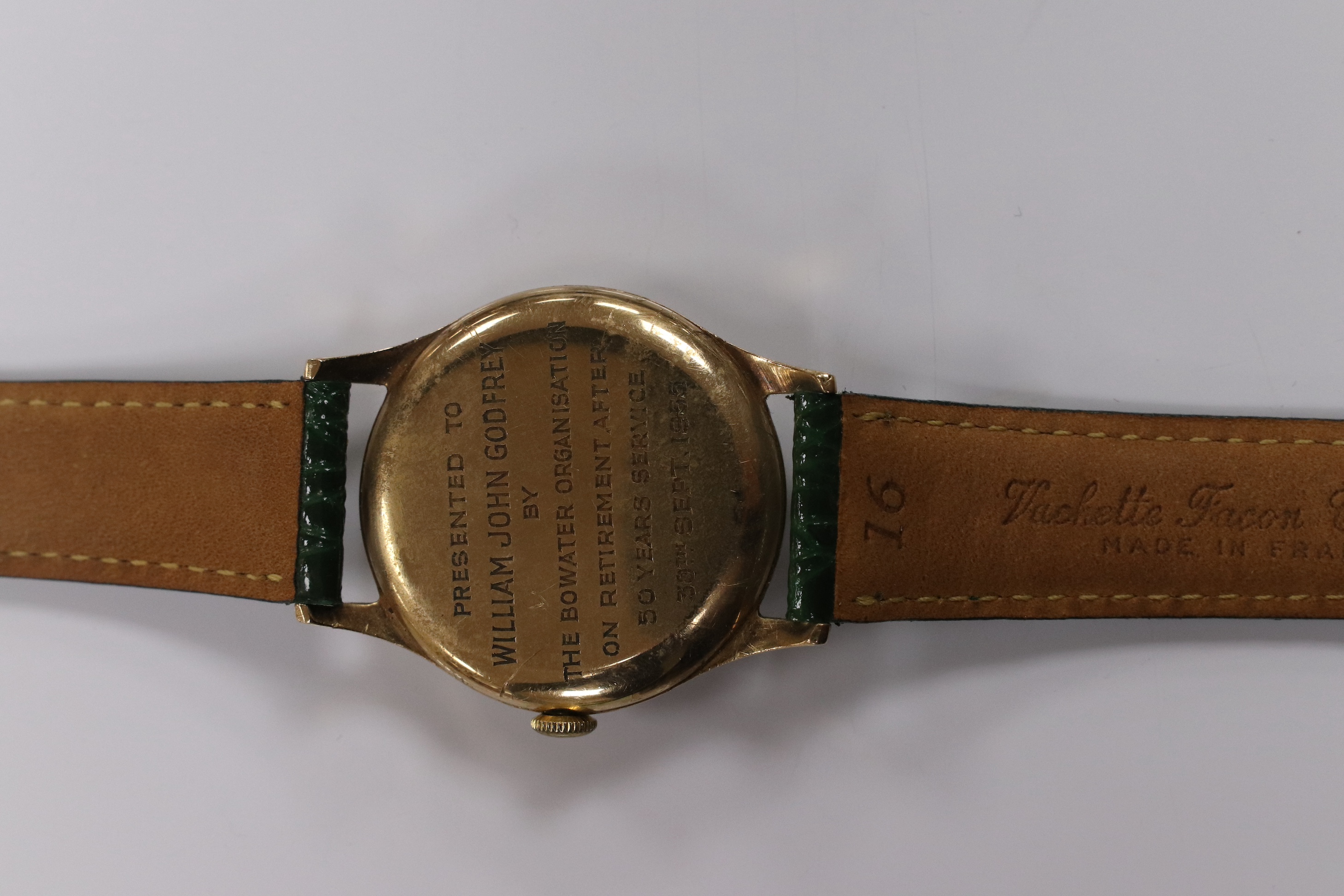 A gentleman's 1950's 9ct gold Movado manual wind wrist watch, with Arabic dial, subsidiary seconds and case back inscription, case diameter 31mm, on a later associated leather strap. Condition - fair